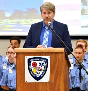 Photo of Dr. Duane Hagelgans standing at a podium.